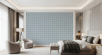 Bedroom with Boho Coastal Grid wallpaper behind a low platform bed and pale bedding., GD9913
