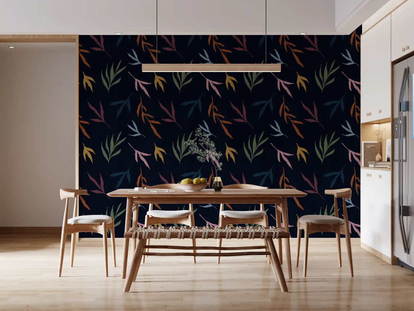 A cozy dining room featuring the dark Tropical Painted Leaves wallpaper.