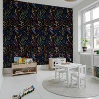 This dark painted collage wallpaper offers a rich and layered look.