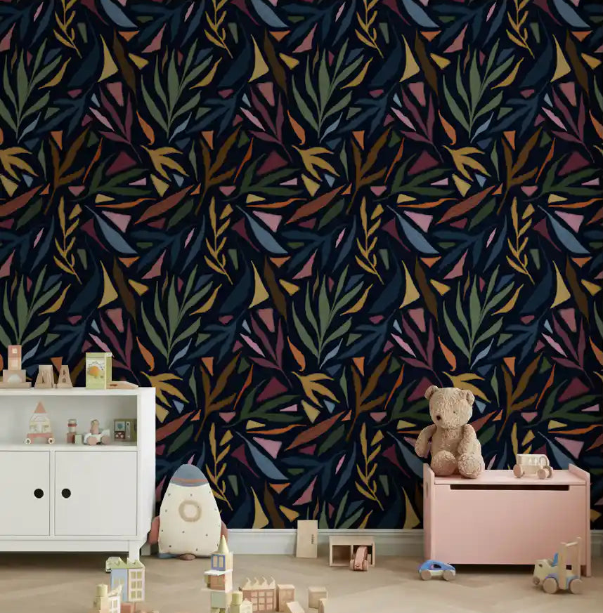 Nursery wall accented with this dark tropical collage wallpaper.