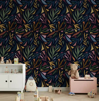 Nursery wall accented with this dark tropical collage wallpaper.