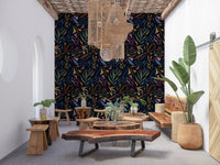 Dark Tropical Collage wallpaper features stylized leaf shapes in ochre.