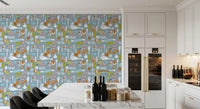 Whimsical floral and vegetable icons on a dusty blue veggie wallpaper.