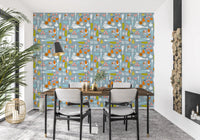 Dining room walls accented with this dusty blue veggie kitchen wallpaper.