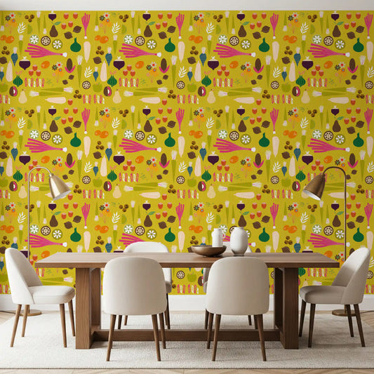 A bright mustard vegetable wallpaper lines the walls of a sunlit dining room.