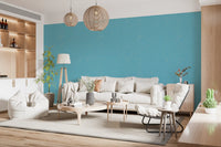 Mid century blue linen wallpaper creates a calm look in a living room.