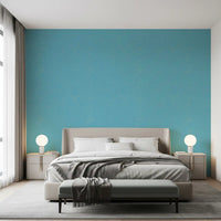 Bright blue linen texture wallpaper brings a fresh vibe to a bedroom.