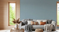 Light blue linen wallpaper offers a clean aesthetic for a bright entryway.