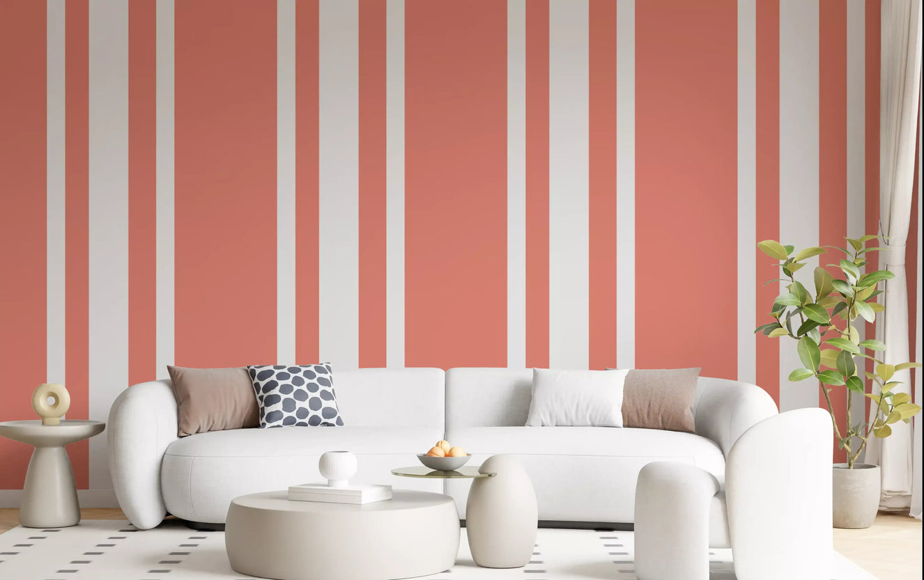 Soft coral ticking stripe wallpaper installed beautifully across a spacious living room.