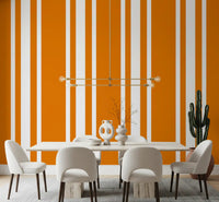 Vertical orange stripe wallpaper in retro style for a dining room.