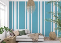 A bright living room features this retro blue stripe wallpaper.