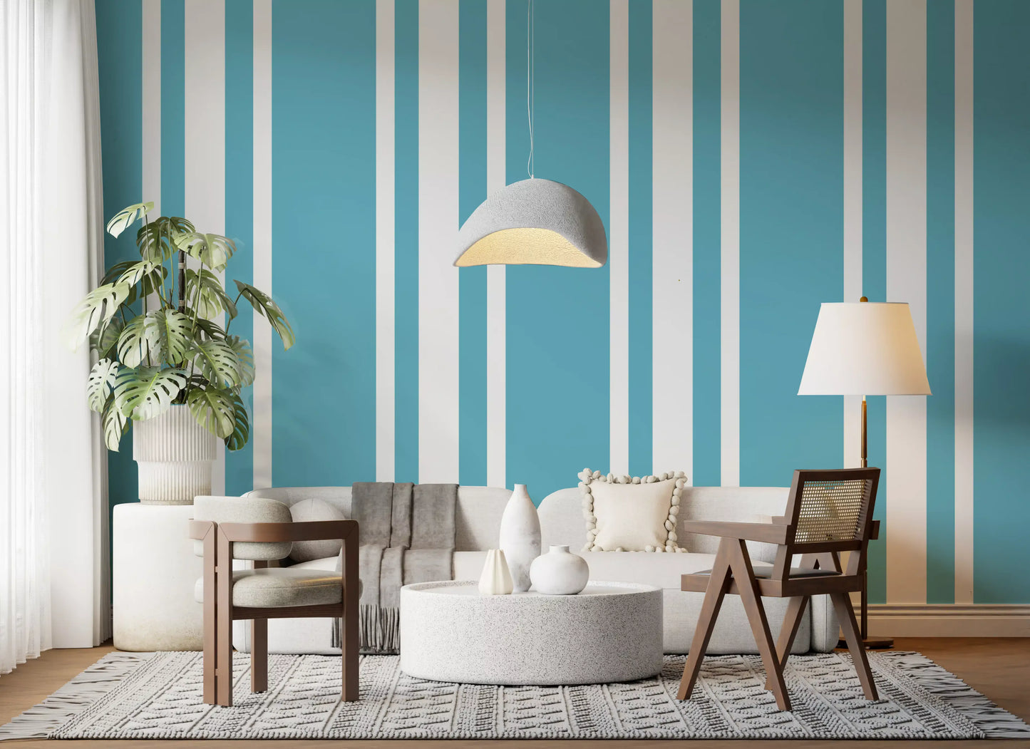 A sunlit living area displays mid century blue ticking stripe wallpaper.