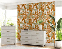 Warm orange backdrop with muted green citrus wallpaper.