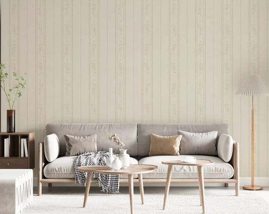 Living room wall covered in cream ivory floral stripe wallpaper beside a white cot and rug.