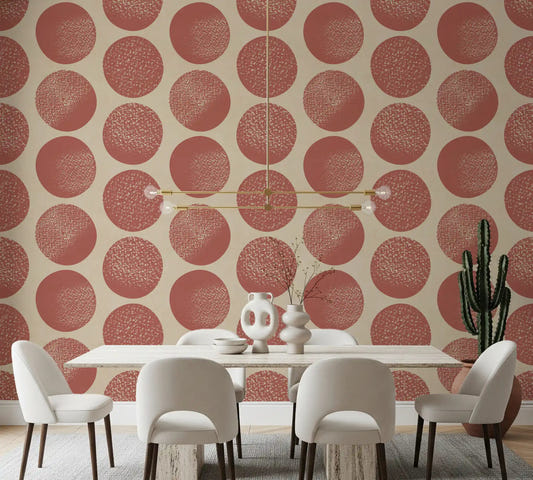 Rust polka dots with stippled texture on warm beige wallpaper in dining room.