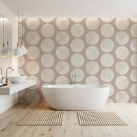 Modern geometric wallpaper combining large circles with delicate stippled in bathroom.
