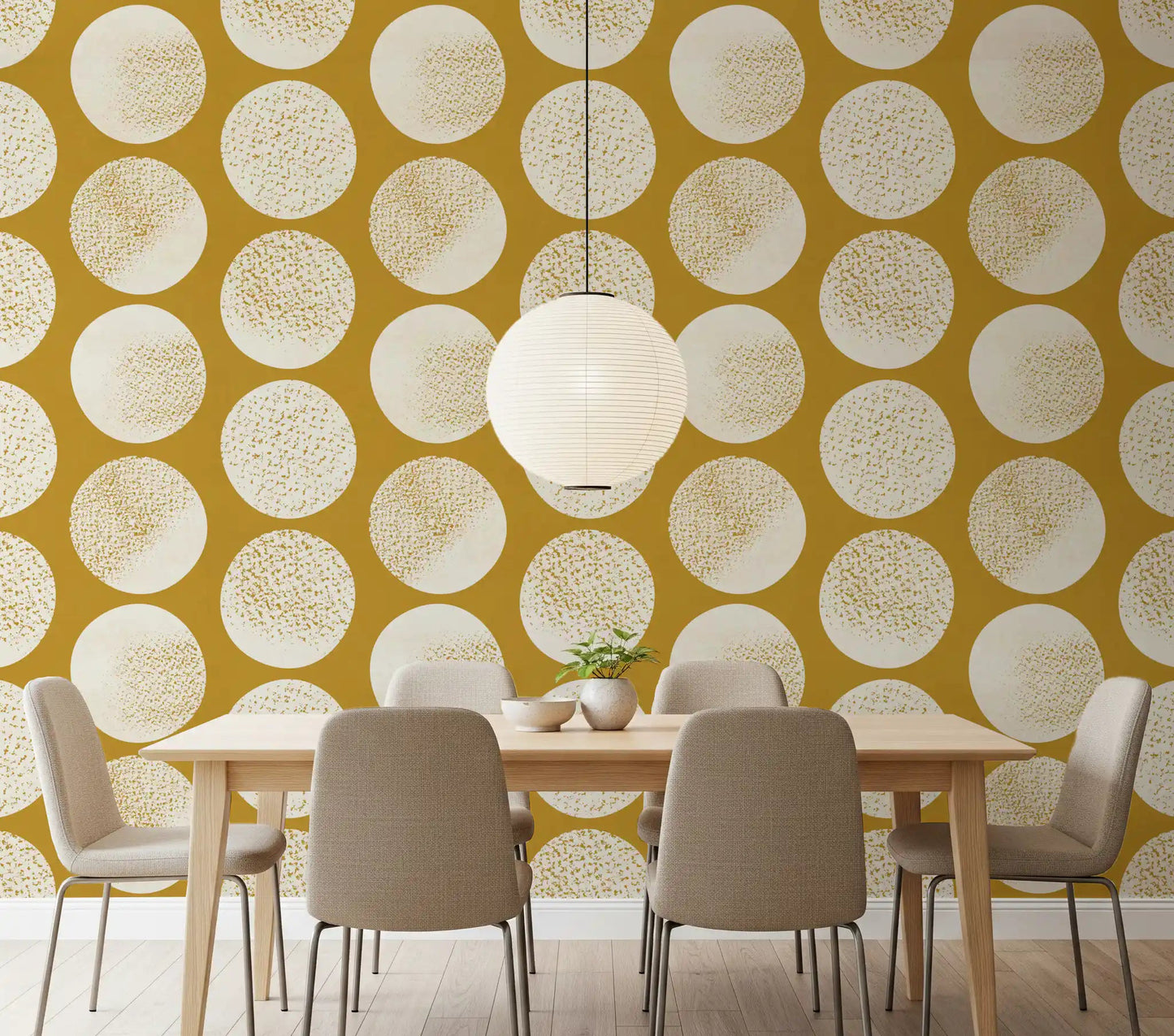 Mustard and cream geometric wallpaper with large polka dots in dining room.