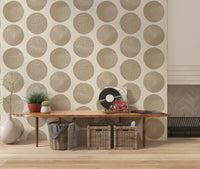 Neutral toned geometric wallpaper with warm beige stippled circle forms.