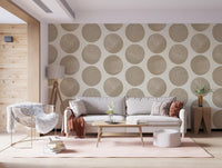 Soft cream and beige wallpaper with organic dotted circle composition in living area.