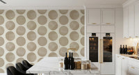 Polka dot wallpaper with textured circles creating subtle depth in dining room.