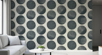 Abstract circles wallpaper with fine stippling detail arranged organically across cream backdrop.