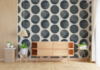 Polka dot pattern wallpaper featuring matte dark blue circles with speckled details.