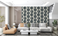 Textured dark blue spotted circles wallpaper creating a contemporary repeating pattern.