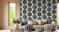 Cream base wallpaper with scattered dark blue spotted circles in a modern geometric arrangement.
