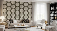 Geometric cream circles layered with fine speckle marks on dark brown wallpaper.