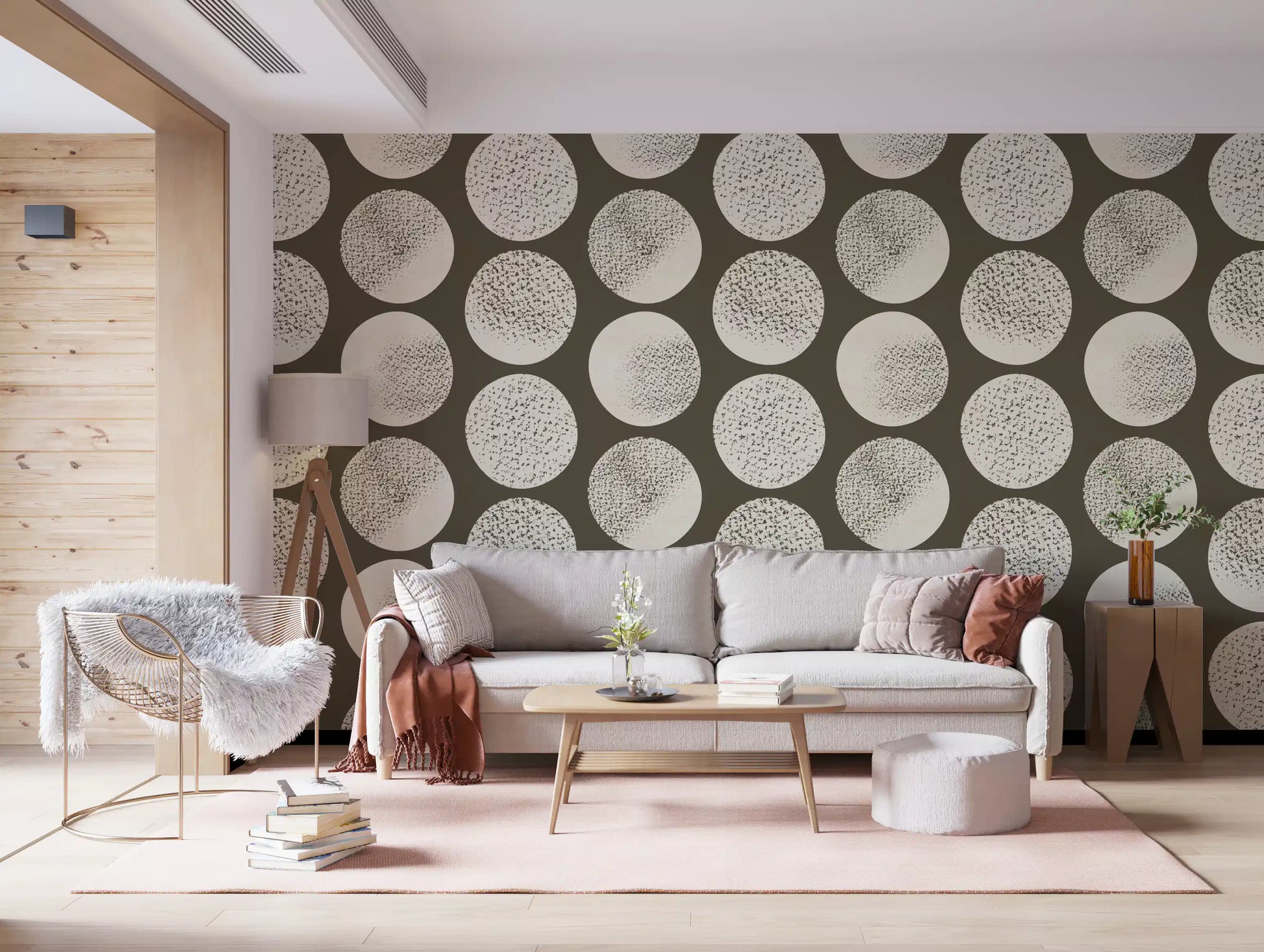 Organic marks and flecks dance across cream circles in this brown wallpaper.
