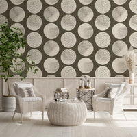 Reading area feature wall showcasing cream stippled polka dot wallpaper on brown base.
