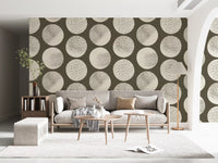 Modern living room wall displaying cream stippled polka dot wallpaper pattern.
