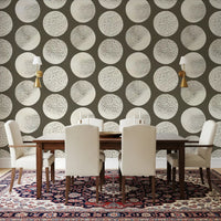 Contemporary wallpaper with textured cream circles scattered on rich brown field.
