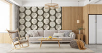 Stippled cream circles showing fine texture detail on brown wallpaper surface.
