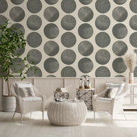 Oversized stippled circles dance across cream wallpaper with slate grey modern geometric design 
