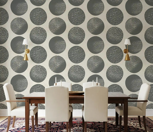 Dining room wall displaying slate grey stippled polka dot wallpaper on cream background.