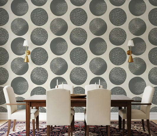 Dining room wall displaying slate grey stippled polka dot wallpaper on cream background.