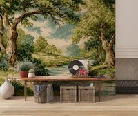 Green woodland wall mural featuring a calm river and textured tree trunks.