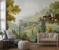 Painted countryside wall mural with green foliage and pale sky scene.