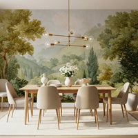 Watercolor landscape mural showing a misty valley and cypress trees in dining room.