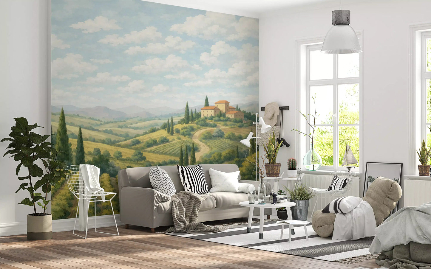 Pastoral landscape mural with cypress trees and distant mountain range in living room.