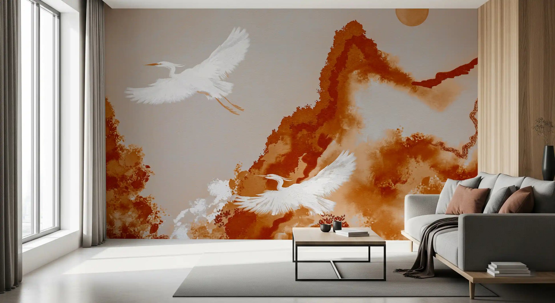Living room mural with crane silhouettes and watercolor mountain panorama.