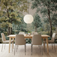 Sage green woodland mural with painted river and white wildflowers in dining room