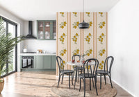 Vertical wallpaper panel with two lemon-and-olive sprigs stacked above a slim brown border line.