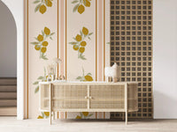 Lower lemon cluster of the wallpaper showing four fruits hanging from a branched stem in mellow ochre tones.