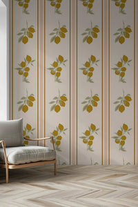 Hallway with terracotta tiles and a wicker armchair against Mediterranean lemon branch wallpaper.