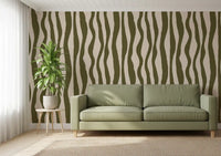 Olive green wavy line wallpaper with flowing vertical stripes and a soft cream base.
