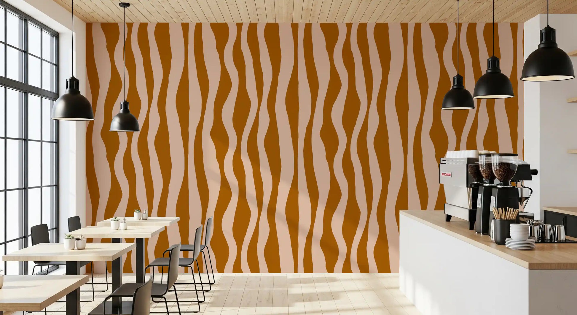 Cafe interior wall dressed in retro boho wavy stripe wallpaper design.