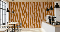 Cafe interior wall dressed in retro boho wavy stripe wallpaper design.