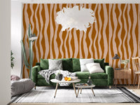 Living room feature wall styled with retro wavy stripe wallpaper in terracotta and pink.